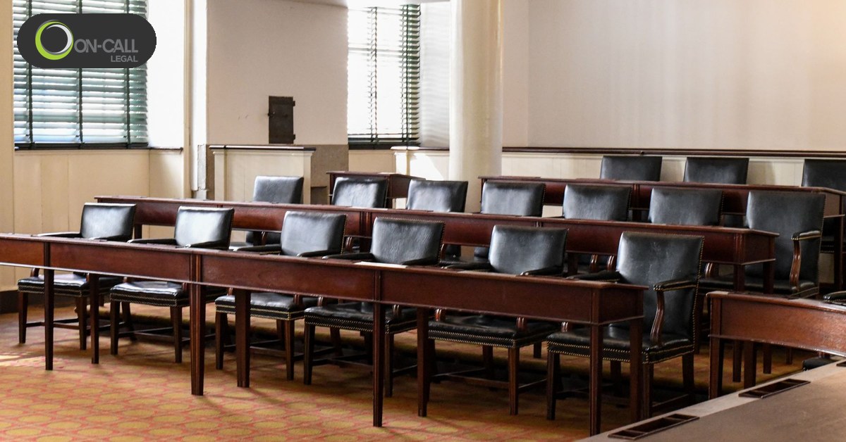 An empty board chamber with desks and chairs set out for a public meeting
