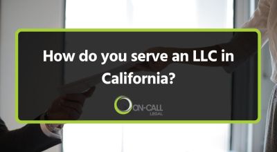 Papers handed across an office desk and the article title, How Do You Serve an LLC in California